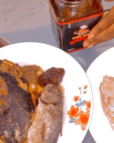 Person enjoying BrƐme Shito - Authentic Ghanaian Black Pepper Sauce